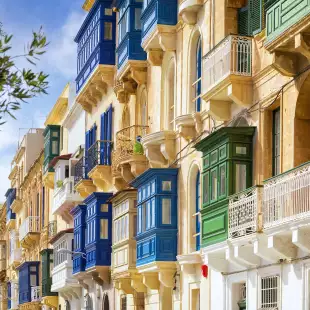 Traditional closed wooden balconies on the streets of Valletta, Malta