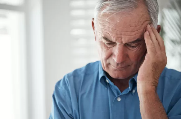Cropped shot of a senior man suffering from a headache